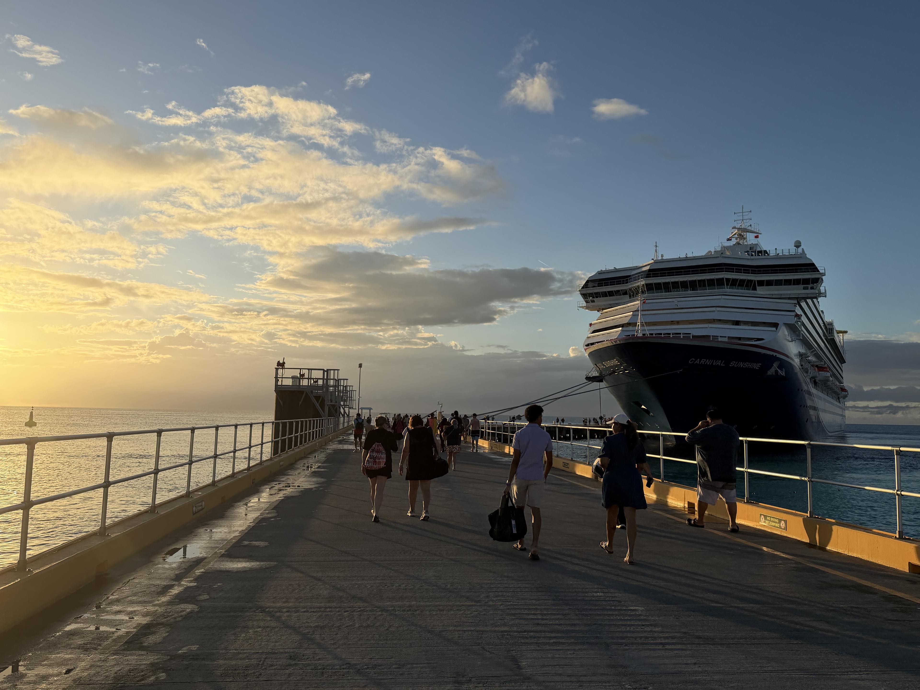 Carnival Sunshine docked at golden hour — the arrival, before anything goes wrong